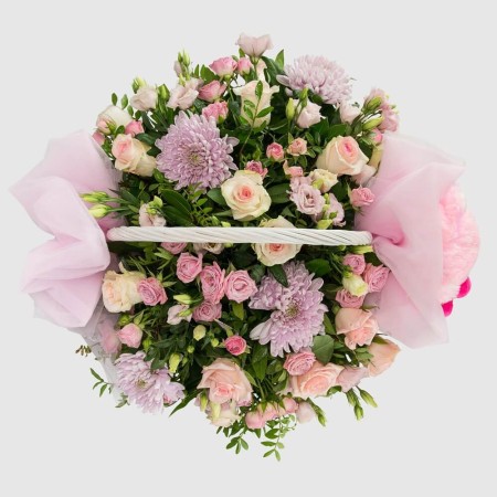 Composition in a basket for a newborn girl It